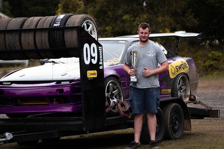 Brendan with his trophy and the pile of tyres he chewed through. Photo by Jed Shipway