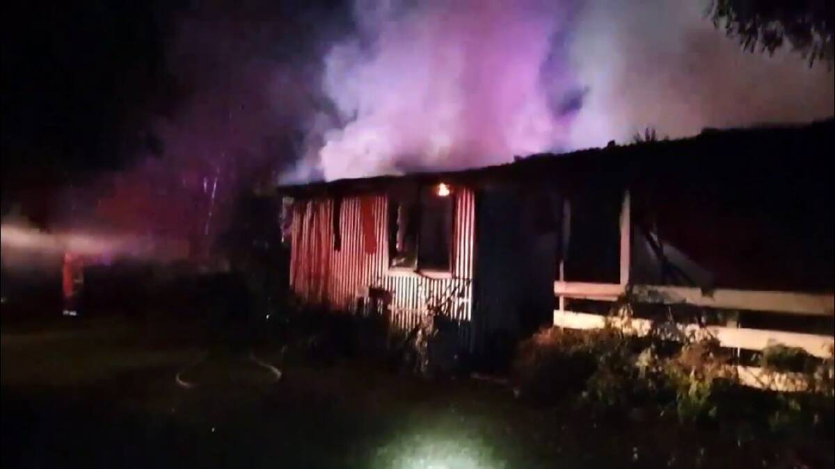 A still from footage of the second fire which destroyed a shed/garage and two cars