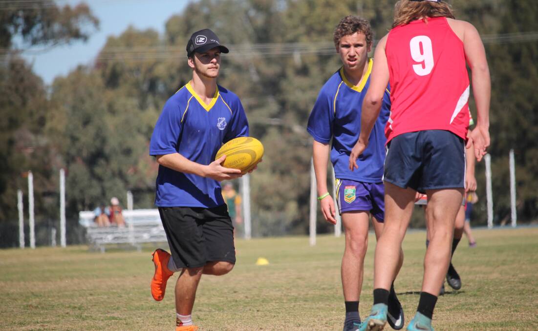 Opens Touch: Brady Atkins with ball and Simon Walker