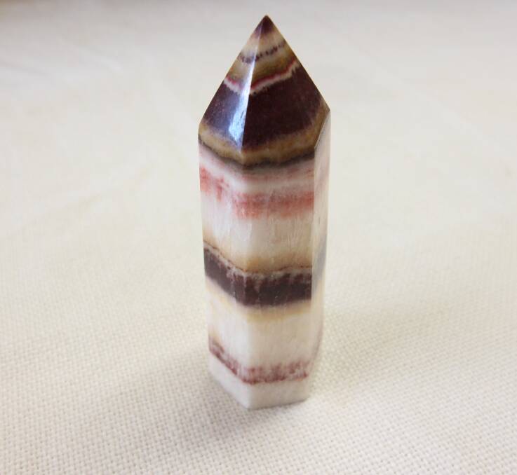 A banded calcite point