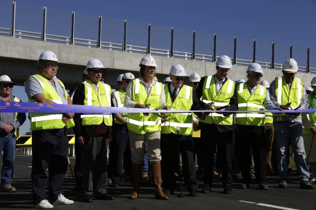 (From left) Dr Ray Jones, Uncle Rob Bryant, Mel Pavey MP, Garry Nehl MP, Luke Hartsuyker MP, Senior Project Manager Chris Clark and Uncle Gary Williams cut the ribbon to the new Warrell Creek Highway
