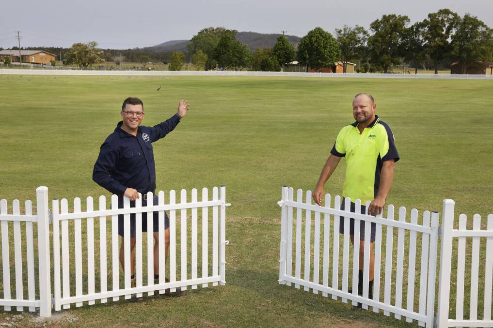 Facility upgrade organisers Dane Luffman and Michael Stennett are chuffed with how the fence has come together