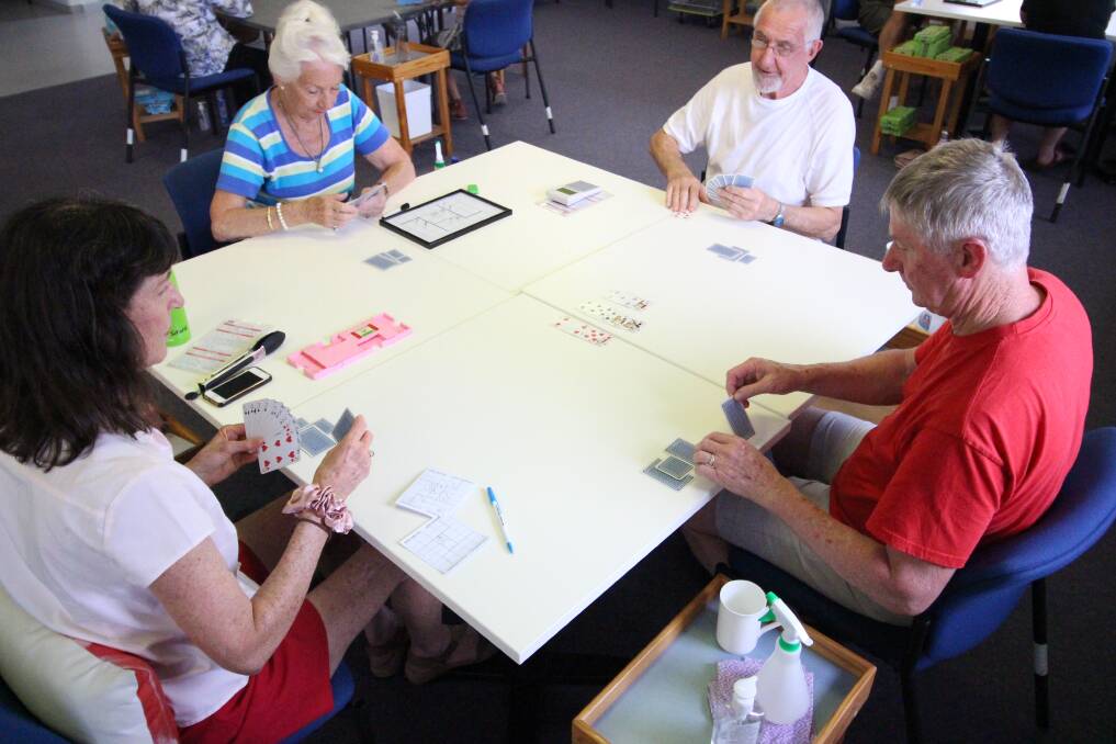 Games are played around a set of four tables instead of the customary one, to ensure social distancing. And each table has its own cleaning station.