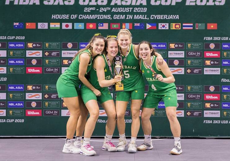 WINNERS ARE GRINNERS: Casey Valenti-Paea, Shyla Heal, Ruby Porter and Georgia Amoore celebrate after their undefeated tournament. Pictures: FIBA