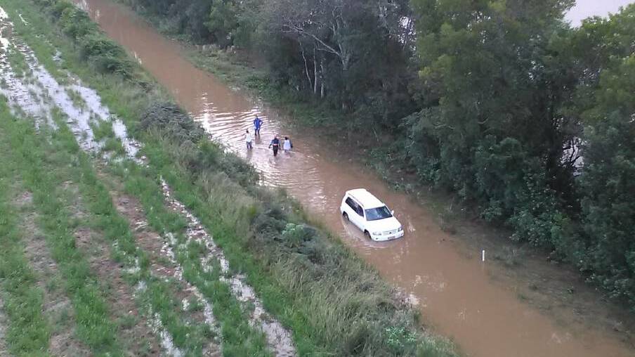 In March this year the Port Macquarie SES unit assisted two people from this flooded vehicle at Telegraph Point. Pic SES - Click the photo to take you back to the full story.