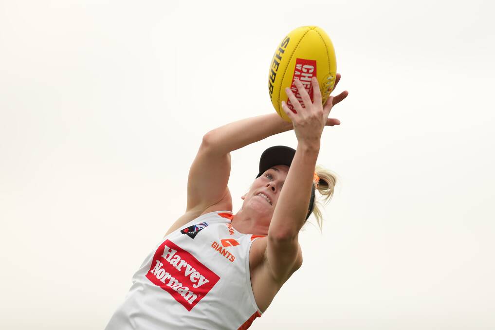 FULL FLIGHT: Nelson Bay's Lisa Steane, who turns 25 next month, takes a mark at Giants pre-season training in Sydney last week. She's aiming to make her AFLW debut in 2020. Picture: Getty Images