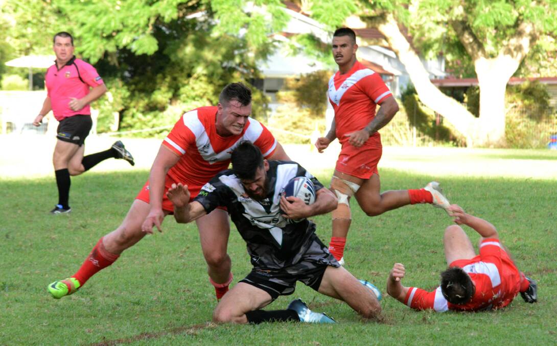 LAST YEAR: Louis Taylor, Bellingen's Man of the Match, fends off an attack. Photo Richard Layt