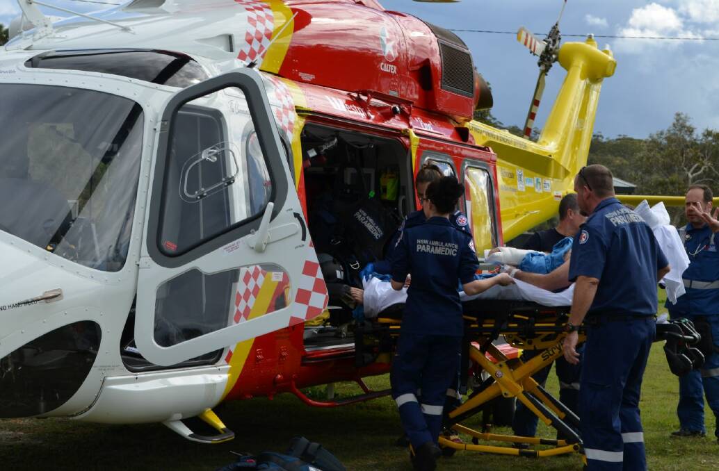 Badly injured man being loaded into the Westpac Helicoper at Wooli. Photo Nikki Voss