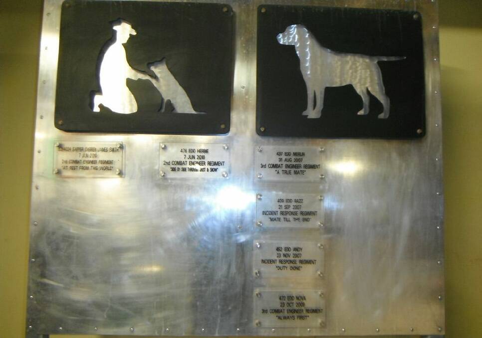 MAN'S BEST FRIEND TO THE END: A memorial at Poppy's in Tarin Kowt, Afghanistan, for those Aussie dogs and their mates who paid the ultimate sacrifice.