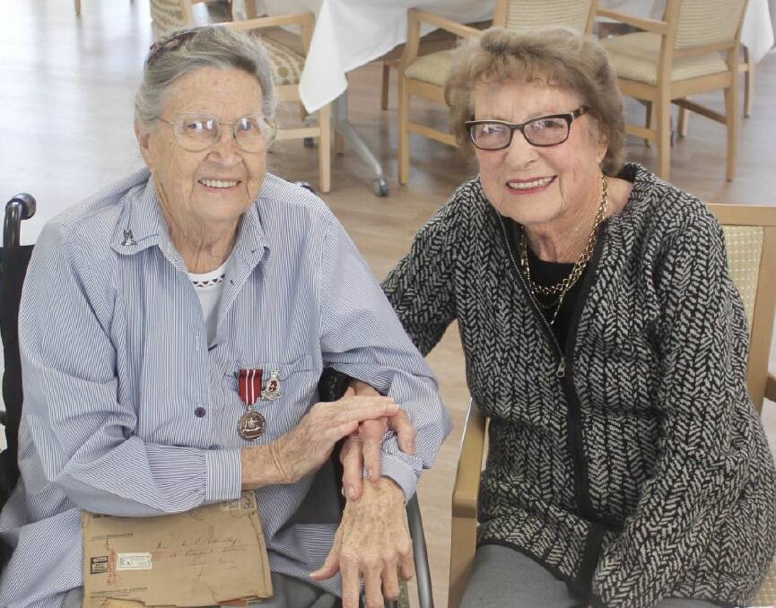 HONOURED FOR SERVICE: Mary Ode (left) and her close friend Lena Compton. Mary is proudly wearing her Australian Defence Medal and the badge of the Royal Australian Army Nursing Corps. Photo: Mick Birtles.