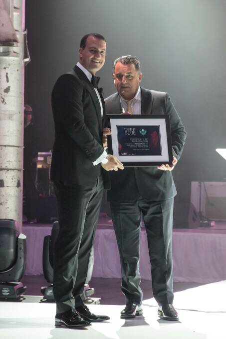 Tony Smith is presented with certificate of thanks by Daniel Tartak 