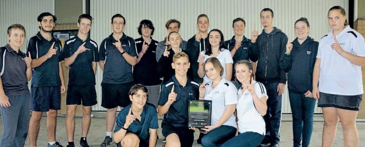 The successful Bowraville Central team with the winners' plaque following an against-the-odds triumph in an inter-school challenge run by the University of Newcastle.
