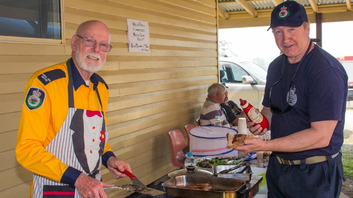 Former Soldiers turned RFS volunteers Patrick Wolf and Michael Williams on hand to advise locals at the NSW RFS Get Ready Weekend at the Valla RFS Brigade. Photo: Mick Birtles