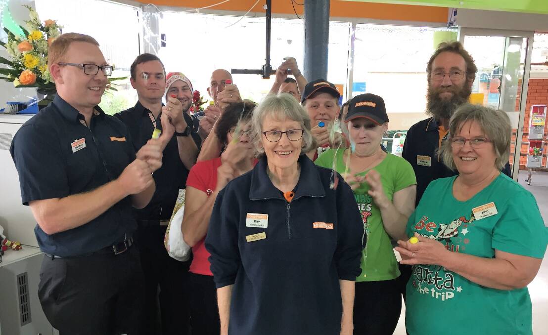 Staff at Foodworks let off party poppers to celebrate Kay's retirement.
