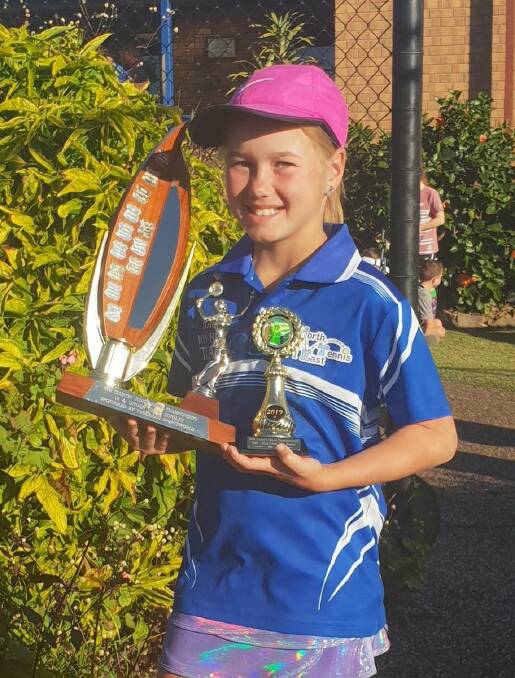 Sienna Anderson of Nambucca Tennis Club with her trophies for the 10 year girls singles and doubles events at the NSW Country Championship held in Forster. Photo supplied.