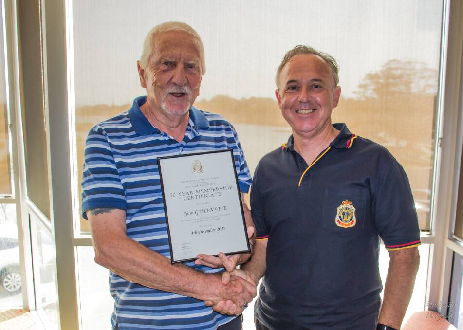 STILL GOING STRONG: John Guyenette is presented his certificate for 50 years membership with RSL NSW by Mick Birtles, President of the NBH RSL Sub Branch. Photo: supplied