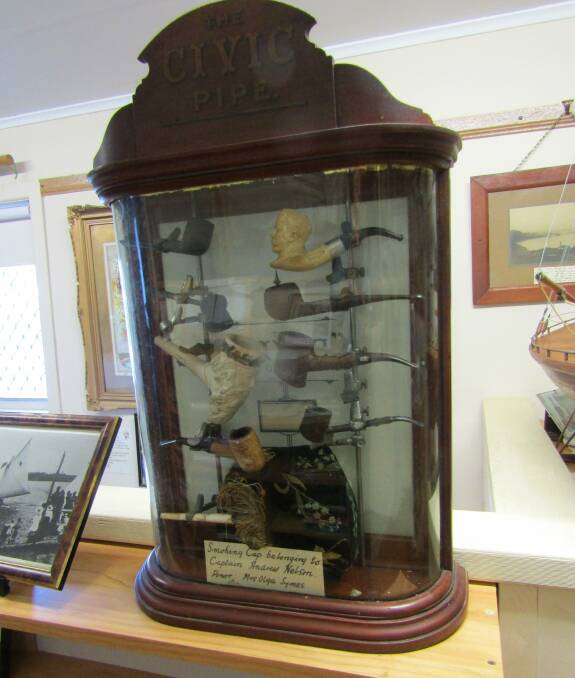 There is a "smoking cap" which belonged to Captain Andrew Nelson at the Nambucca Headland Museum among a cabinet of antique pipes. Photo supplied. 