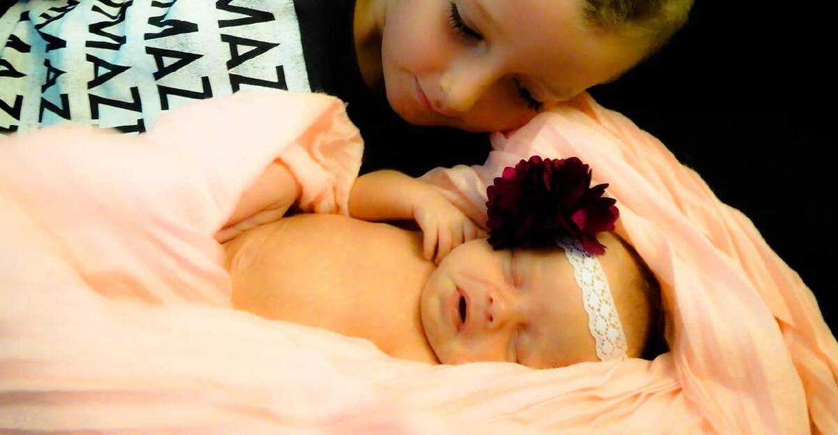 Smitten big brother Noah Mcpherson with newborn sister Izzabella. Photo: Erin Harvey 