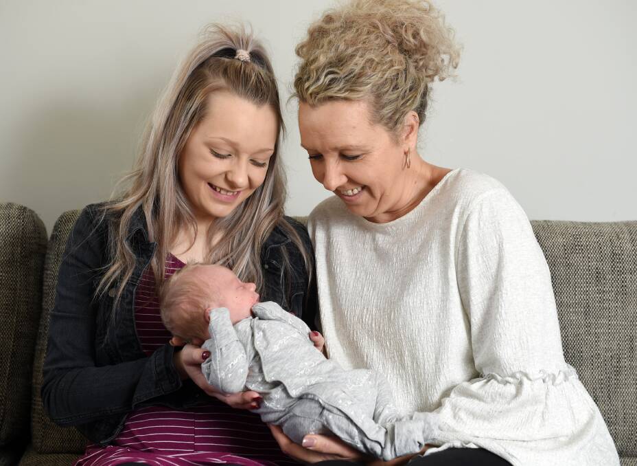 HOME-BORN BUB: Mother Tahlia Hill and grandmother Chrissy Hill can't get enough of little baby Ashyr. PICTURE: Kate Healy