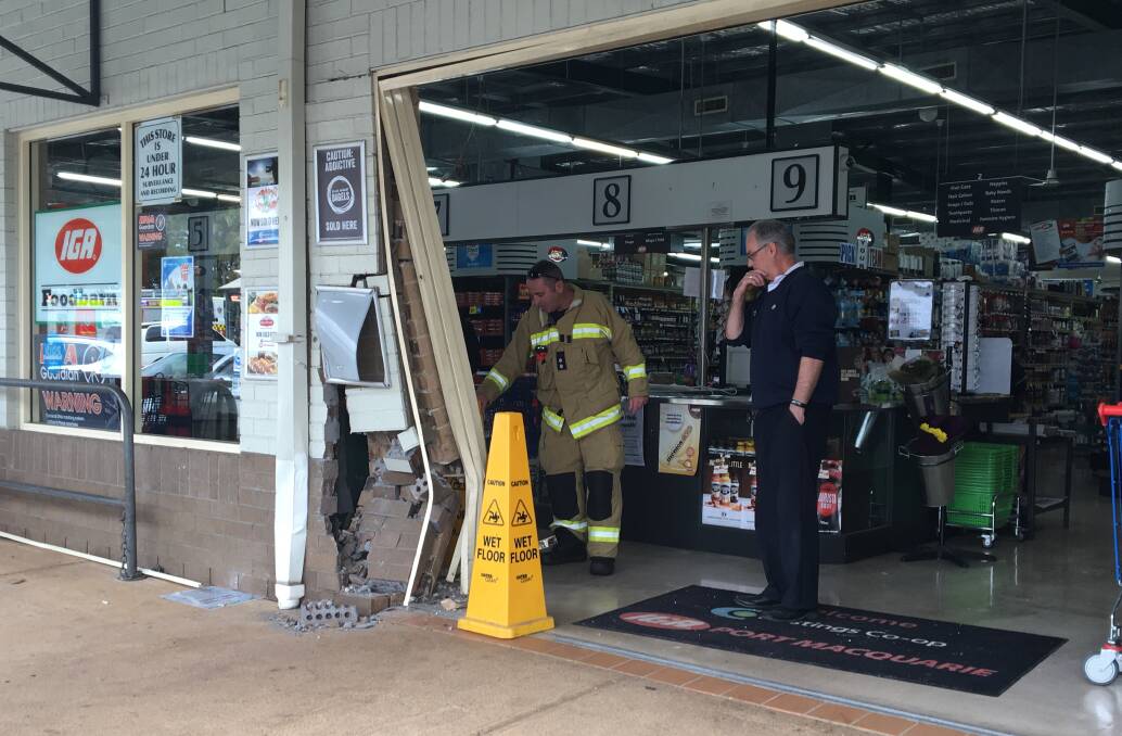 Damage to the entrance of the IGA supermarket after a car hit the building.
