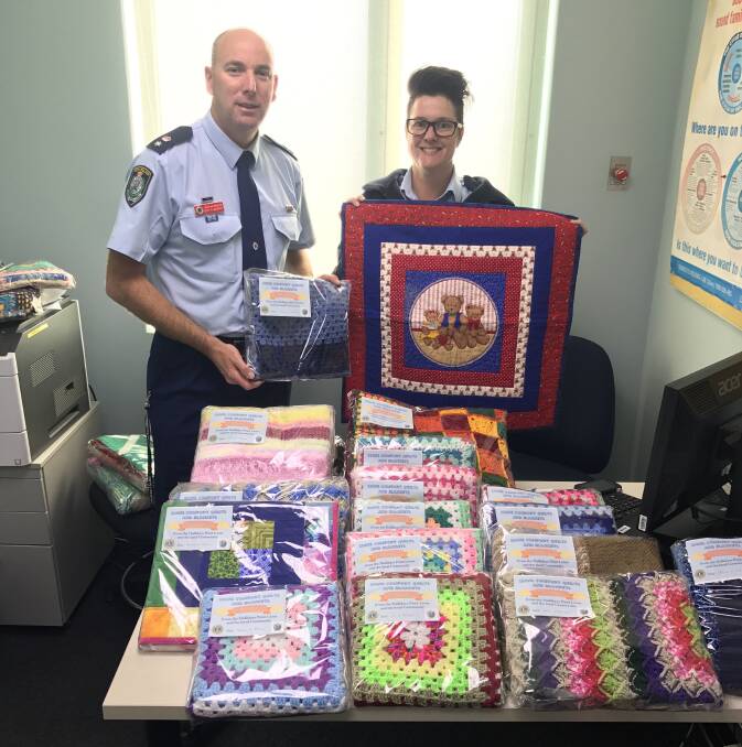 Providing comfort: Acting Commander Guy Flaherty and DVLO Snr Cons Karen Bleasdale are thankful for this special donation.