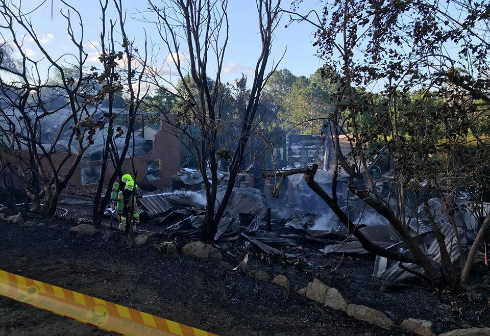 STILL SMOULDERING: Two houses were burnt to the ground in Eungai Creek yesterday. Photos courtesy of FRNSW Port Macquarie.