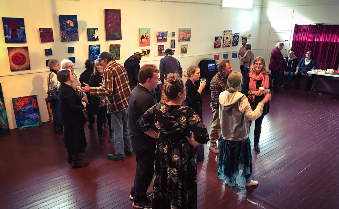 TAFE EXHIBITION: Students and guests mingle on Friday night