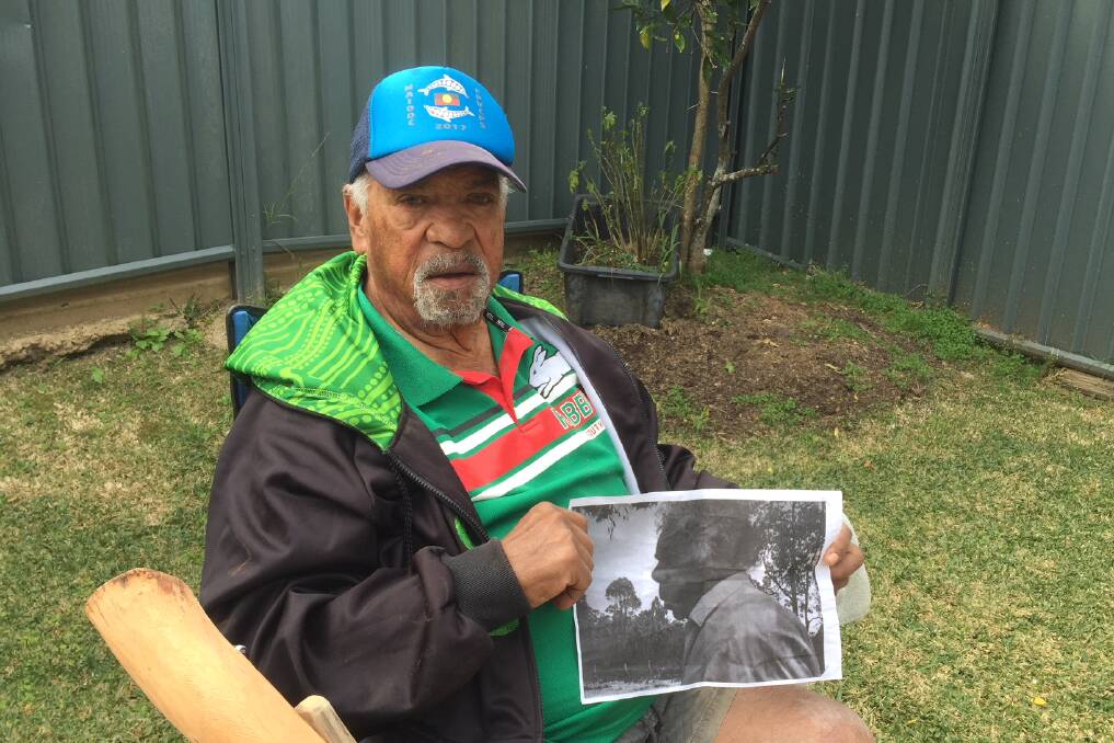 CUSTODIAN: Gumbaynggirr man Uncle Buddy Marshall with a photo of his Uncle Benji