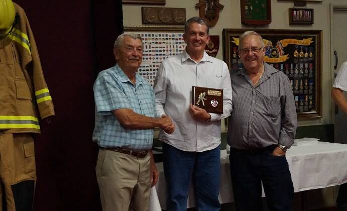 COMMUNITY SPIRIT: Phillip Lane with Dale Brunsdon, left and the late Bill Lenthall at his retirement from the Macksville Fire Brigade.