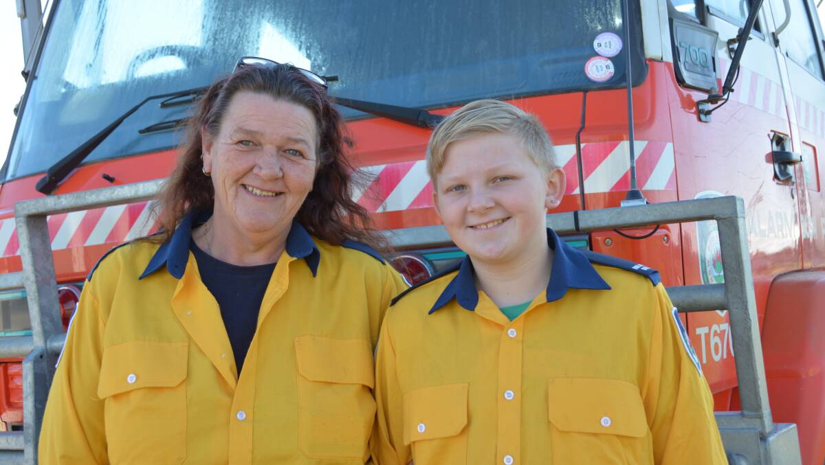 CLIMBING ABOARD: New RFS recruits for the North Macskville brigade Teresa Dupond and her son Toby Laurence