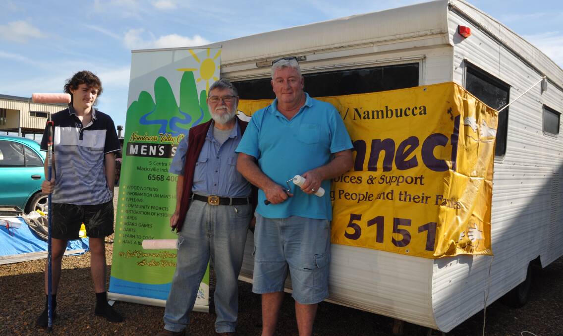 WATERTIGHT: This caravan will offer a safe, dry space for a young Nambucca woman. Finishing the job are, from left, Kaine Watson, Stu Holmes and David Stamel