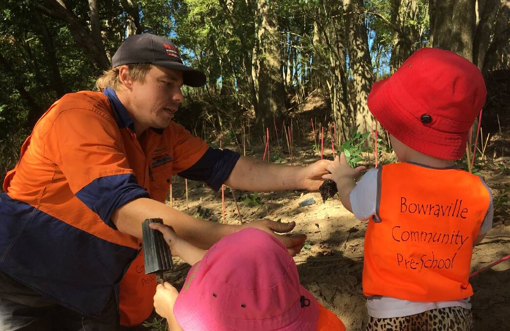 LITTLE HELPERS: Bowraville Community Pre-schoolers got their hands dirty helping Nambucca Shire Council Green Space Site Leader Keegan Noble plant native trees 