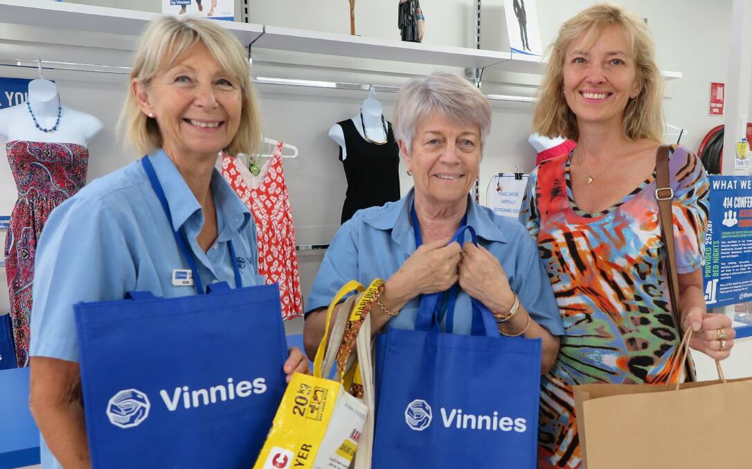 PLASTIC BAG BAN WELL RECEIVED: From left, volunteers Shona Townend and Noelene Geraghty with customer Misha Harding