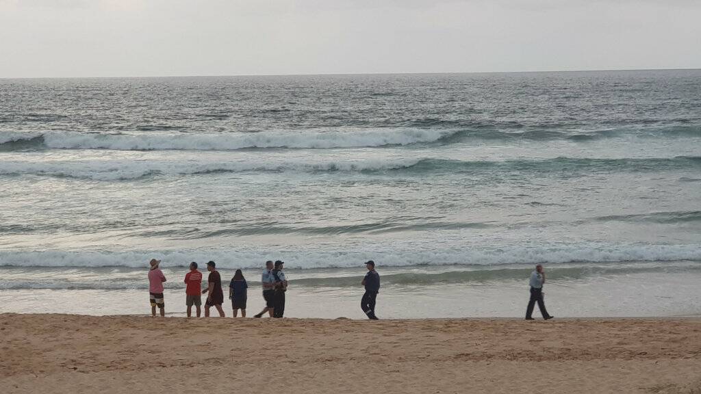Emergency services conducted a full scale search for a swimmer who went missing after being caught in a rip at Valla Beach at about 5.30pm on Saturday. Photo: Frank Redward