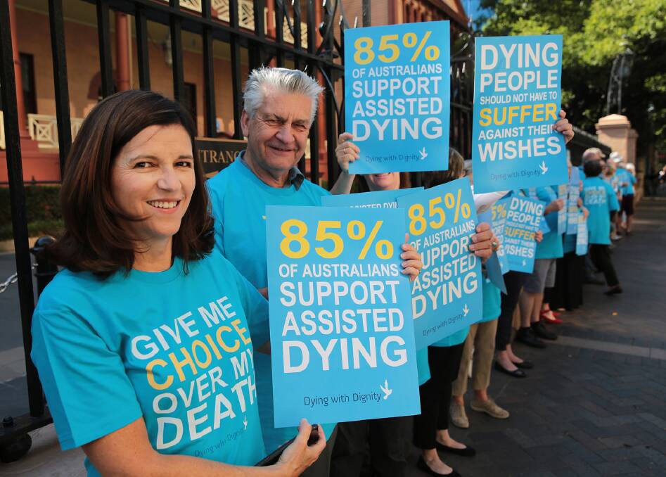DWD Vice President, Shayne Higson (on left) and DWD member Stan Malicki with other supporters on the morning of the debate of the Voluntary Assisted Dying Bill outside NSW Parliament. Photo: TONY COLEING