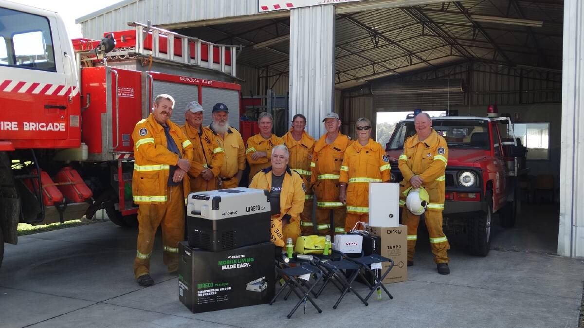 TALARM RFS WITH NEW GEAR: From left, Murray Liddell, Ian Tatnell, Stephen Brown, Dennis Rowsell, Pat Mulquinney, Brian Liddell (Captain), Joanne Eyre, Rueben Wallis.
Sitting: Phil Eyre