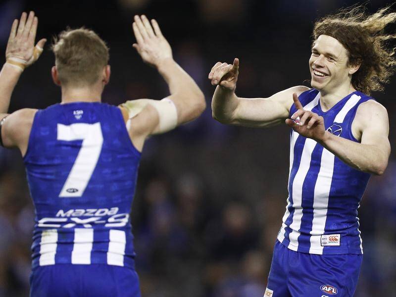 Ben Brown (R) kicked 10 goals in North Melbourne's 86-point win over Port Adelaide.