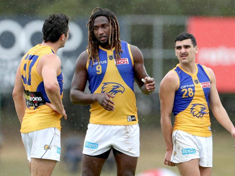 Nic Naitanui (c) has signed a new deal with West Coast a day after an impressive return from injury.