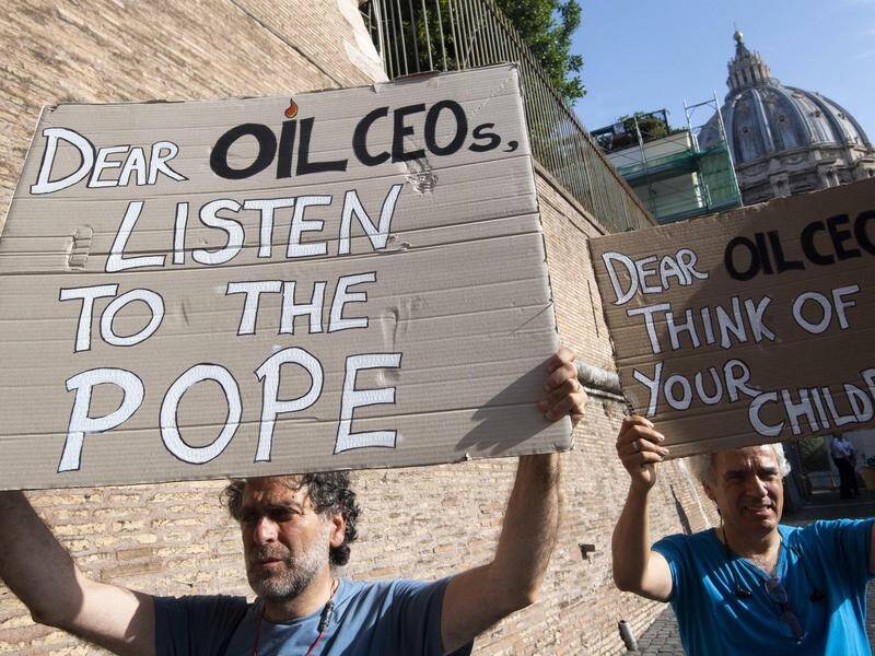 Protesters have backed the Pope's call for carbon pricing to stem runaway climate change.