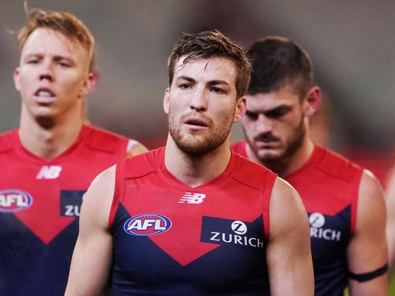 Jack Viney and Demons teammates looks dejected after their dismal defeat to the Swans at the MCG.