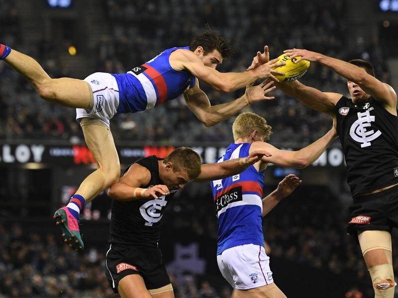 The Western Bulldogs have survived a brave Carlton comeback to win their AFL match by three points.