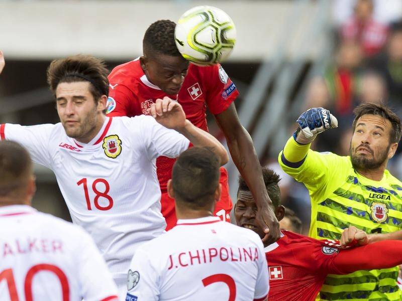 Denis Zakaria (c) heads Switzerland into the lead in their 4-0 Euro 2020 victory over Gibraltar.