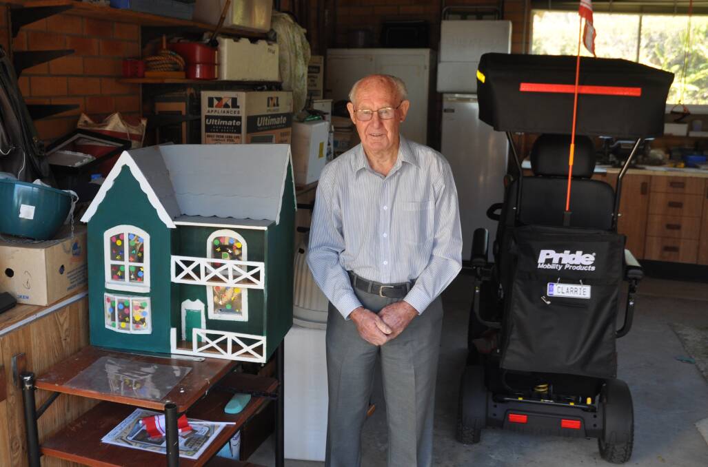Clarrie's latest project is building a dollhouse for one of his grandkids. Photo: Stephen Katte 