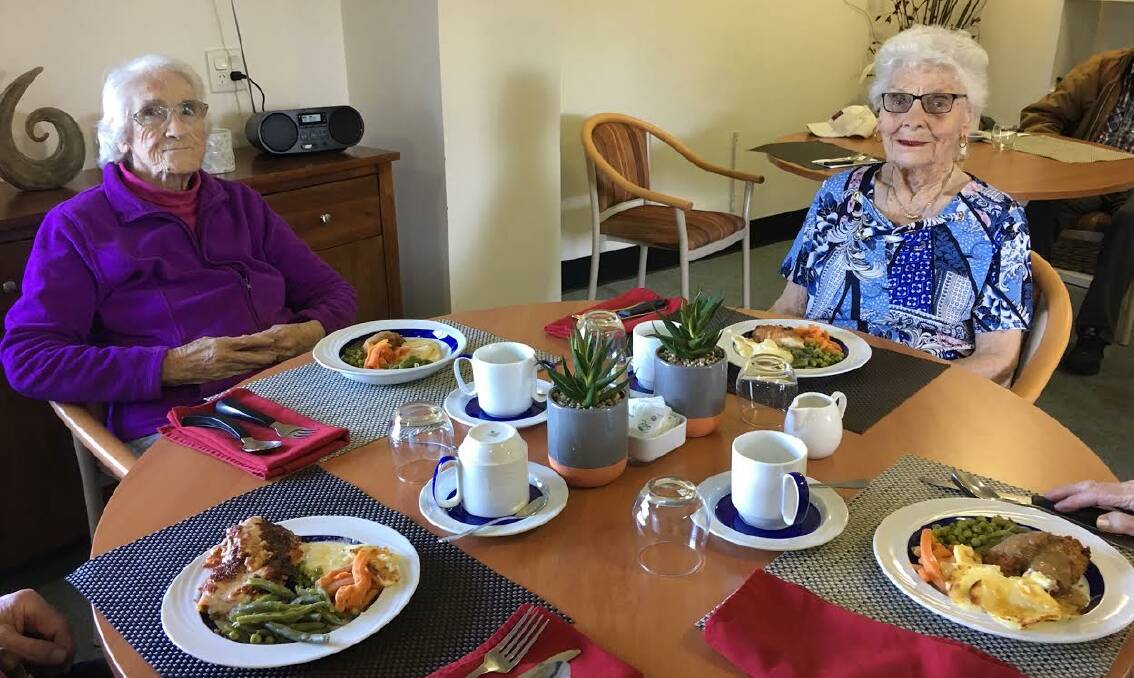 Residents with the new dining aids. Photo:Supplied 