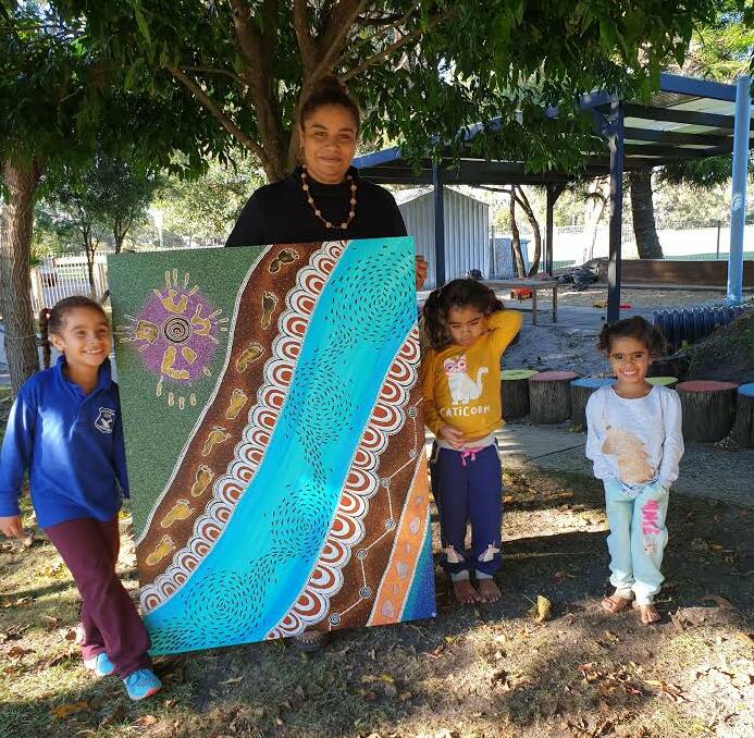 Juanella's children Ngarlaa, Ngayan and Ngintaka often help their mother with her art. Photo: Supplied 