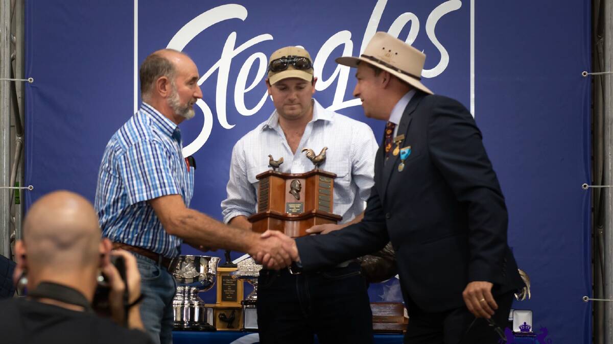 Ted Vaughan accepting one of his trophies. Photo: supplied 