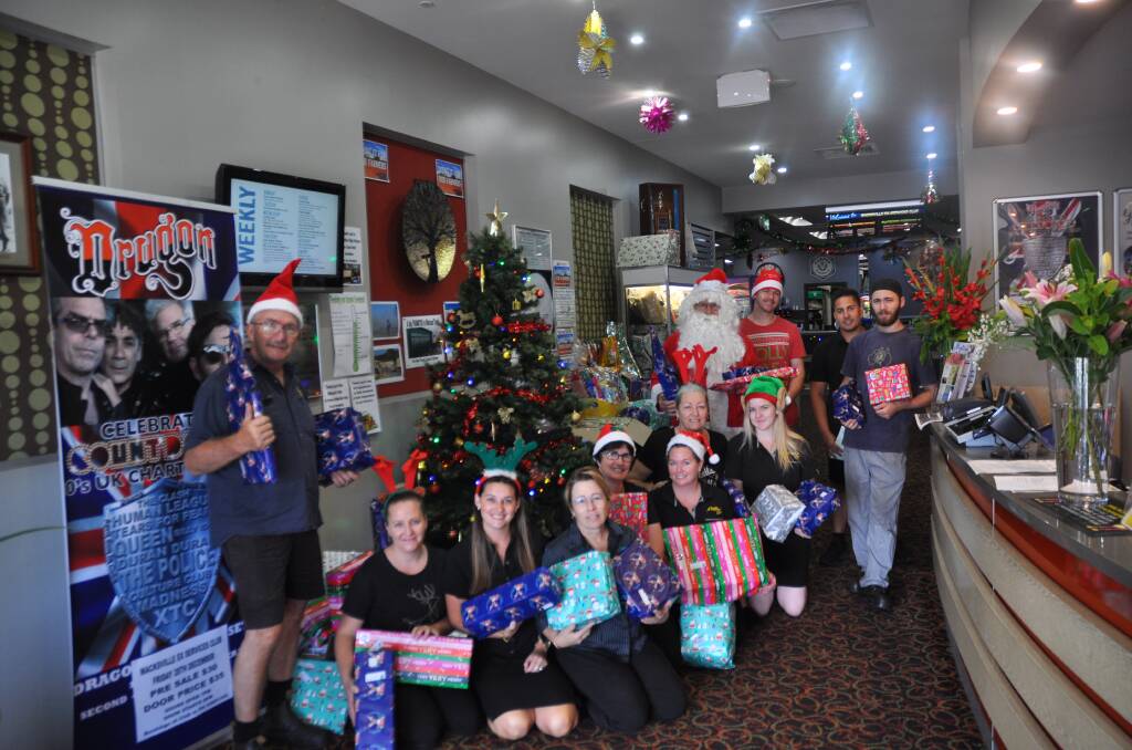The team at the Macksville Ex-Services club with some of the donated presents. Photo: Stephen Katte