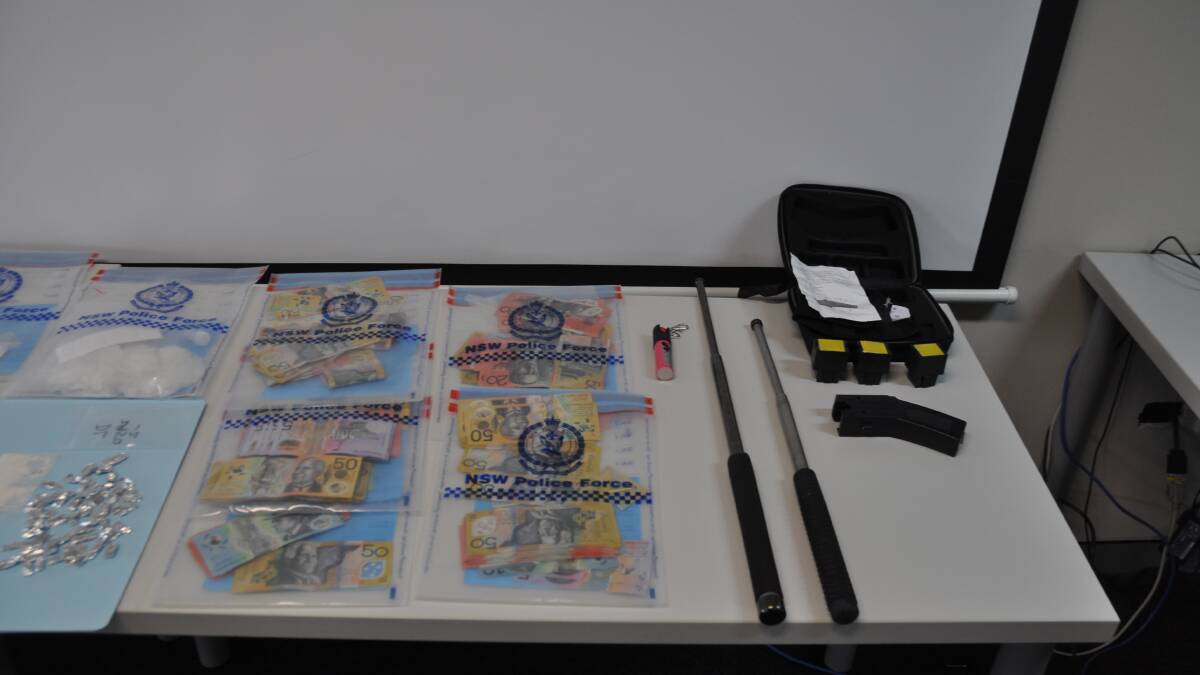 A taser, two batons, and capsicum spray were recovered during the operation. Photo: Stephen Katte 