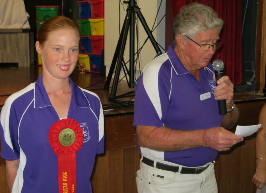 Victor and Jacoba accepting the Country Music Clubs Donation on behalf of 'Riding for the Disabled' based at Kempsey. Jacoba displaying Ribbons won recently at the Royal Easter Show 2019. Photo: Supplied 