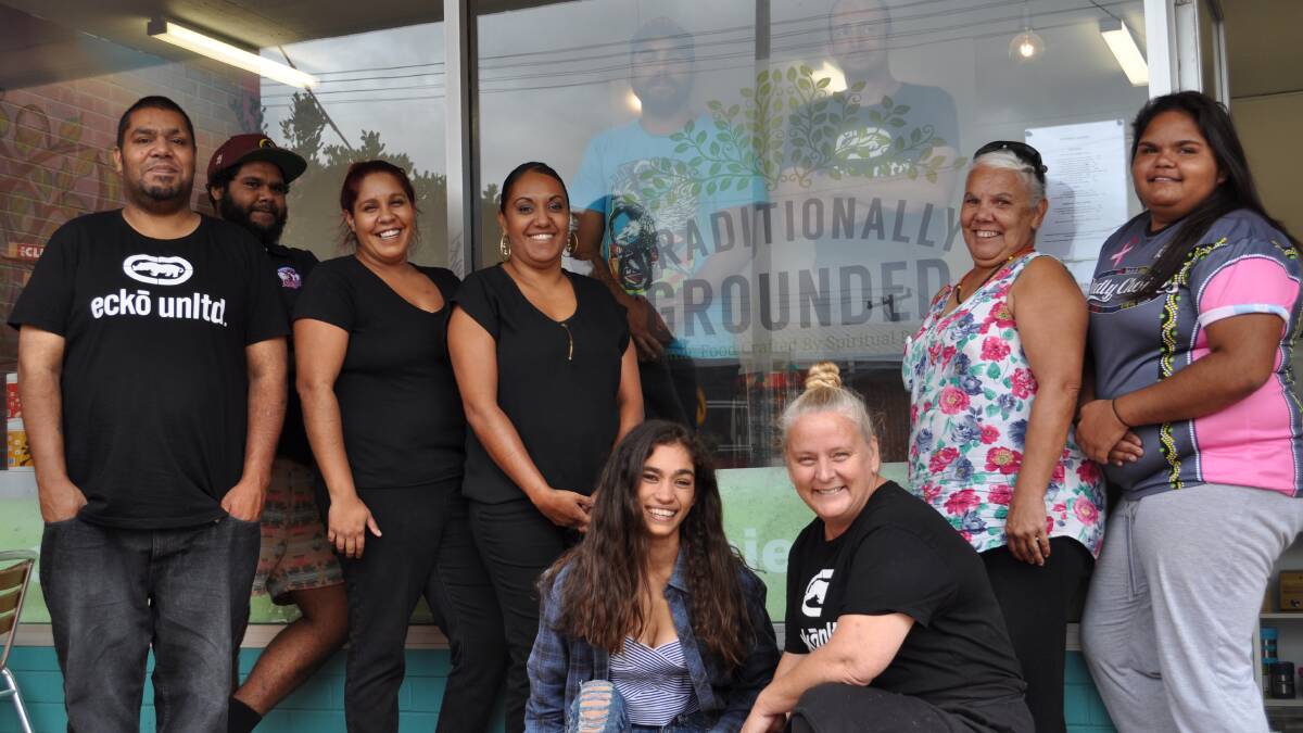 TRADITIONAL AND GROUNDED: The café team, from left, Wesley, Kieran, Lorraine and Amanda Jarrett, Joshua Jarrett and Luke Graham (inside window frame), Noelene Ballangarry and Katelyn Dungay with Naomi Campbell and Louise Robinson (kneeling). 